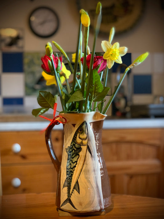 Terracotta jug, fish decoration