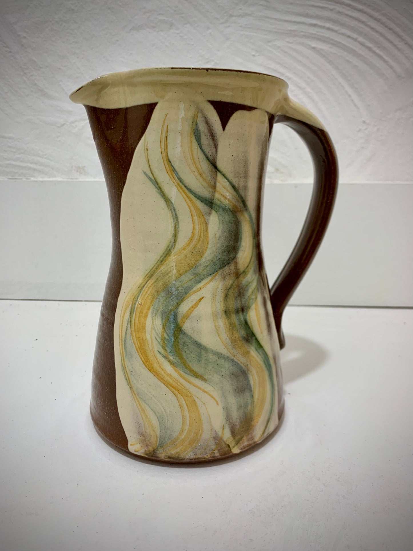 Terracotta jug, fish decoration