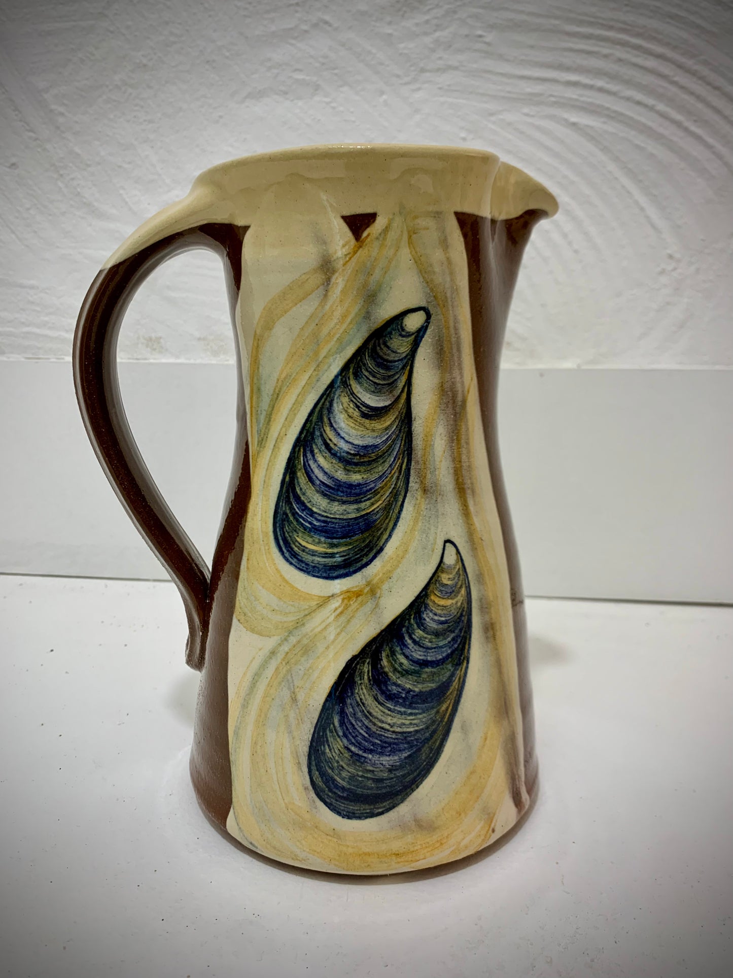 Terracotta jug, fish decoration