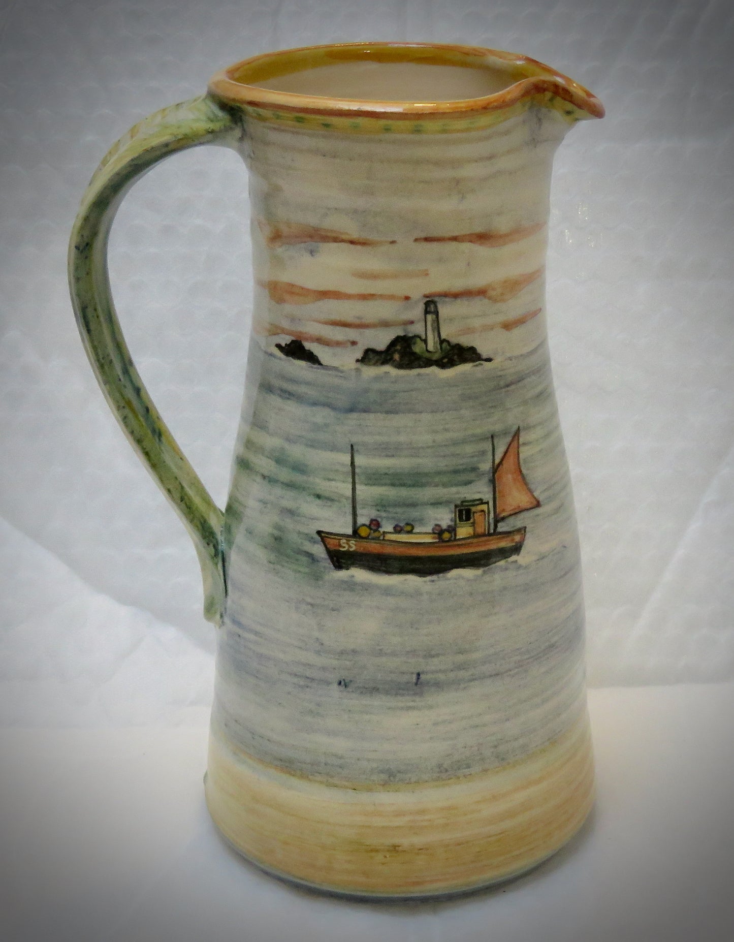 Decorated pottery jug, lighthouse 22 cm